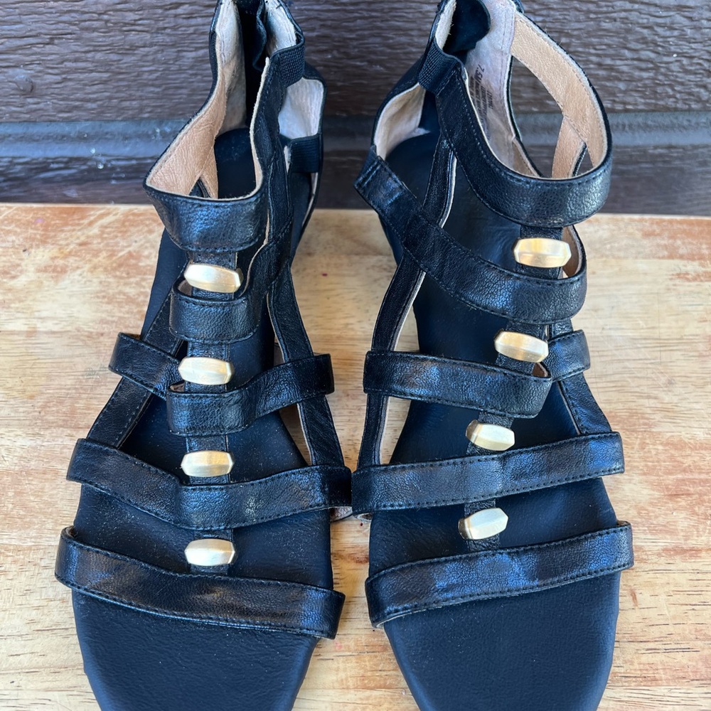 Elegant Black Strappy Sandals with Gold Accents